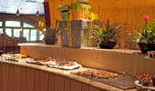 Trays of sweet treats along the buffet line.