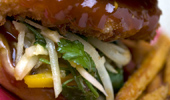 Close up of Hawaiian cheeseburger with teriyaki sauce.