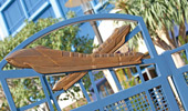 A pair of monorails sculpted on the top of the pool gate