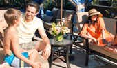A family of 4 has fun inside the poolside retreat.