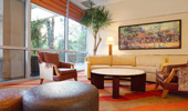 The lobby's waiting area is decorated with wood, leather and warm earth tones.