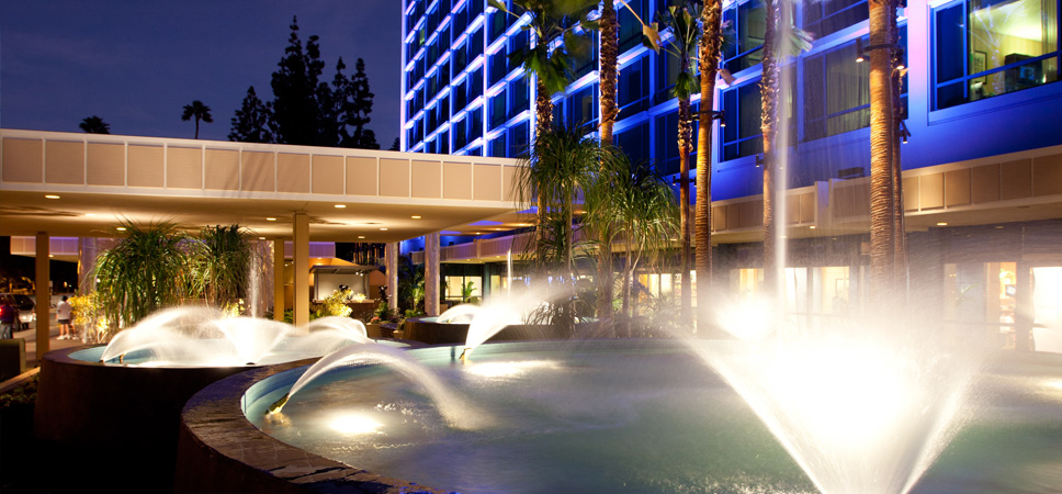  A nighttime shot of the Fantasy Tower fountains at the Disneyland Hotel entrance.