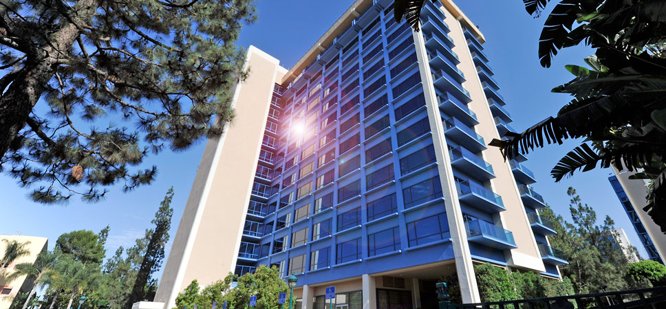 Looking up the Frontier Tower at the Disneyland Hotel, the sun glints off the blue-tinged glass.