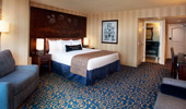 Interior shot of plush and comfortable bed and surroundings.