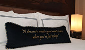 Throw pillow stitched with this saying, 