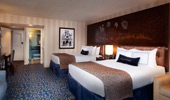 Interior shot of 2 plush and comfortable queen beds and surroundings.