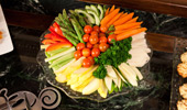 An array of colorful vegetables, like fresh carrots and cherry tomatoes.