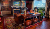 Living area in Adventureland Suite, complete with TV and faux fireplace.