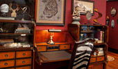 Writing desk with faux zebra-print chair.