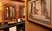 Artwork of elephant bathing in a fountain.