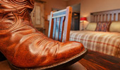 A reading lamp with a cowboy boot base.