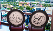 Two chairs near the picture window overlooking the Theme Park.