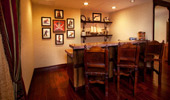 The Suite's wet bar with framed pirate portraits.