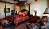 Vintage, 4-poster bed and easy chair.