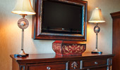 TV, lamps, dresser and pirate decorations.
