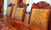 Close up on upholstered dining chairs.