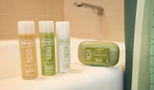 Soap and Guest-size bottles of shampoo, conditioner and body butter.