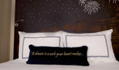 Disney fairy tale touches, like carved headboards and stitched pillows, are found in each room.