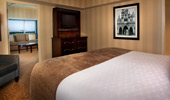  One-Bedroom Suite with king bed and now-famous framed photo of Walt Disney.