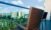 Chairs on a balcony offer an elevated view of the Disneyland Resort.