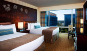 Disney fairy tale touches, like wood headboard, stitched pillow and framed photos, are found in each room.