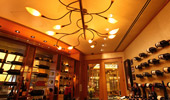 Wide shot of the restaurant's walls lined with wine bottles.