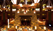 Wide shot of the lobby with the fireplace in the center of the frame.