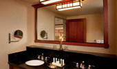 Mirror over the wash basin reflects the room