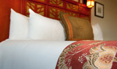 Close up on bedspread detail of elegant gold roses