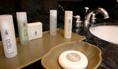 Guest-size bottles of shampoo, conditioner, body butter and soaps