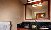 Mirror over the wash basin reflects the room