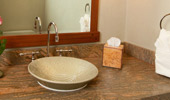 Simple stoneware sink in a muted green with a subtle and delicate floral design