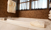 An additional bath, with elegant tub, in the Mount Whitney Signature Suite 