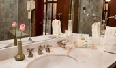 The white marble sink, stocked with Disney Resort's ~H2O+ Spa products