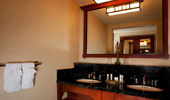 Mirror over the wash basin reflects the room