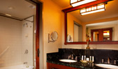 Mirror over the wash basin reflects the room