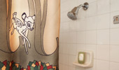 Close up on shower curtain detail of Bambi