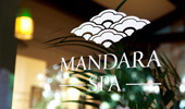 Sign on the glass door: Mandara Spa