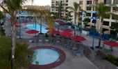 An inviting scene: the pool and spa are surrounded by lounge chairs.