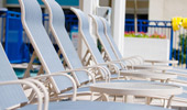 A row of pool-side lounge chairs at Disney's Paradise Pier Hotel.