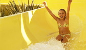 A girl enjoys her ride down the water slide at Disney's Paradise Pier Hotel.