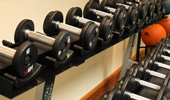 Rows of free weights at the Fitness Center, so you can stay in shape during your stay.