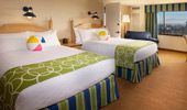 In the room: 2 queen-size beds decorated with beach-ball pillows.