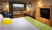 Club-Level Room with king bed, media console and beach-themed decor