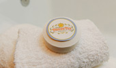 A round bar of Disney's Paradise Pier Hotel rests on a plush washcloth.